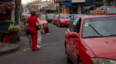 Lady in red crossing the street