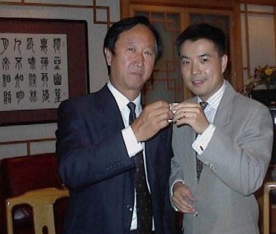 Mayor Wang and Shawn toasting with traditional china liquor cups (shaped like wine glasses by much smaller)