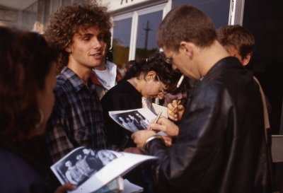 Adam Clayton signing autographs, Rome, 1987