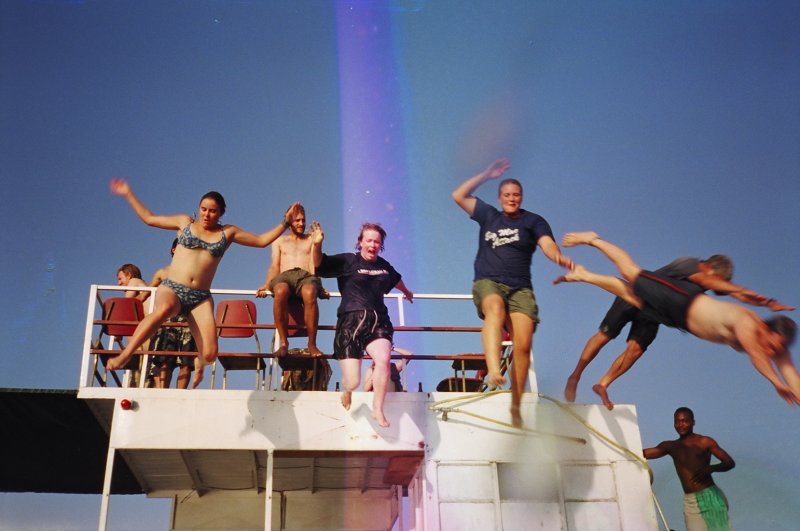 Peace Corps volunteers at the end of their rainbow
