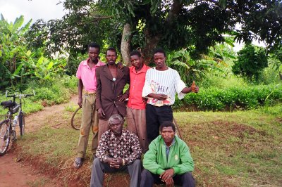 Fish farmers standing behind front left headman.JPG