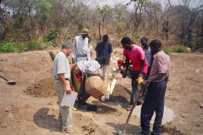 Making potting soil from sand, manure and duff.JPG