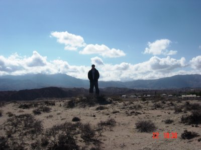 Aibek w village behind.JPG