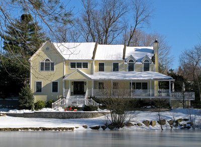 Yellow Home by Frozen Lake