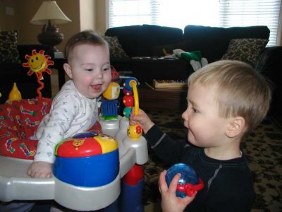 joey likes the toys on elisabeths exersaucer