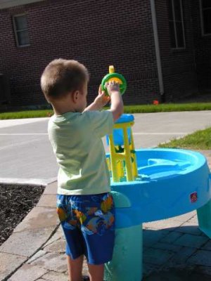 playing with his water table