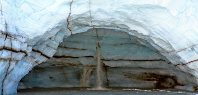 Cave made by melting glacier stream