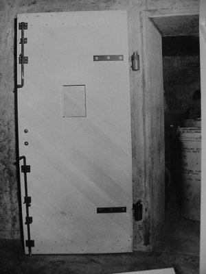 Rare photo -- Btry Townsley powder magazine door open, 1943. Note powder cans / tanks at right.