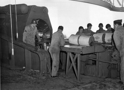 Loading powder bags at Btry #131. Red ends contained black powder igniter charge. (U.S. Army)