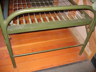 Folding ends on World War II stacking bunk.