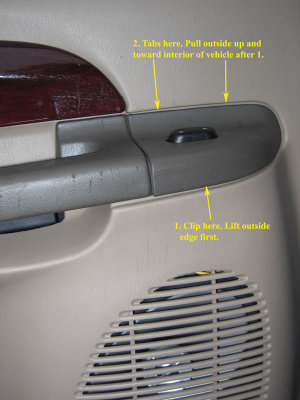 Rear door panel removal. Lift the outside edge to remove the clip. Pull up and away from door.