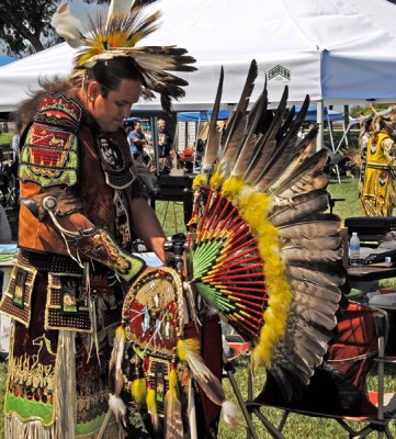 Warrior takes off back feathers piece