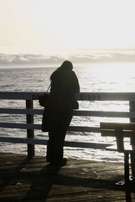 A wistful stranger gazes out to the sea