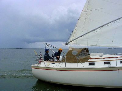 Marie helming WHISKERS 30C close aboard in light air