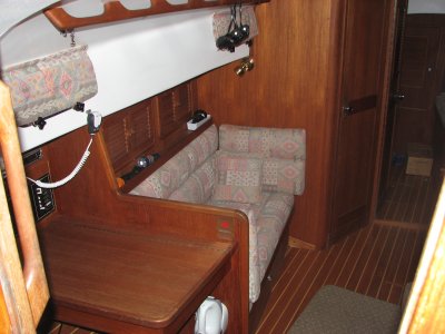 port - navigation station, then settee, then head