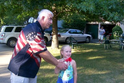 Glenn Taflan and neighbor blowing the starting horn for 2007 Cornhole Tournament