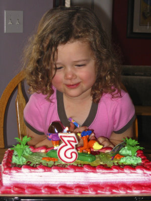 morgan 3rd birthday blowing out cake