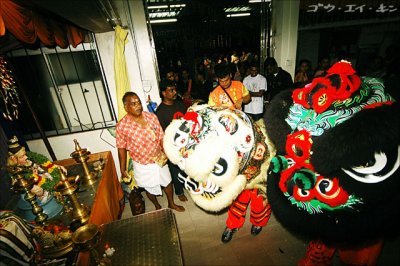 Chinese lion dance troupe invited by Chinese temples nearby