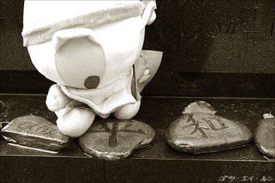 carved stones and soft toy left by students