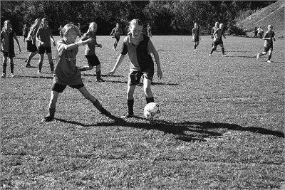 Girl's Soccer game in the bright autumnal sunshine