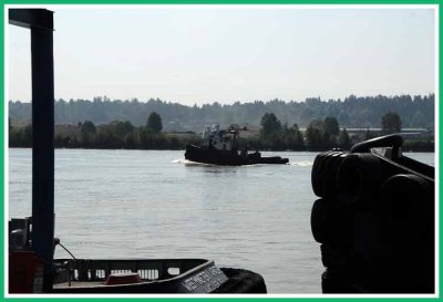 Silhouette of river tug.