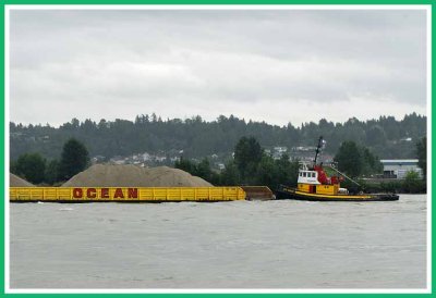 Evco Breeze assisting a barge.