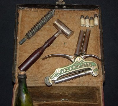 Contents:  Corked Vial, Bristle Brush, ACME No. 15 Measure, 4-330 PP Bullets, 2-Nickel Plated Cases, Kingsland Re-Decapper