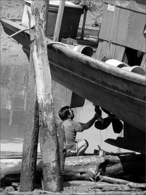 A Fisherman Fixing His Boat I