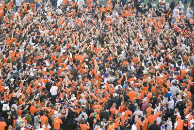 The team was mixed in with the crowd after the game. They had to call a play to get blocking in order to get to the locker room