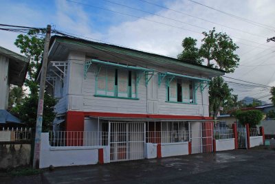 white house across colegio dela milagrosa