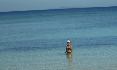 Lin enjoying her time on the secluded beach and crystal clear water.
