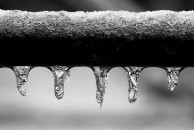frozen drops on a hand rail