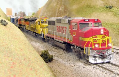 Four units tackle the grade with 54 grain cars behind.