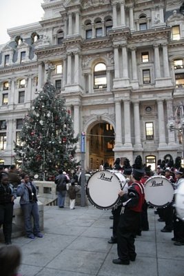 1.  A crowd gathers for the lighting of the City Hall tree.