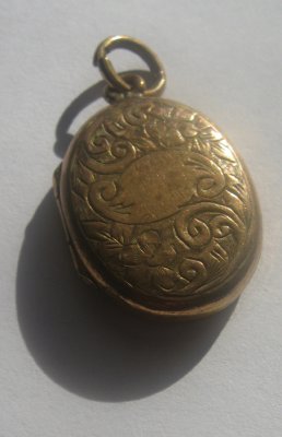 victorian locket with shadow