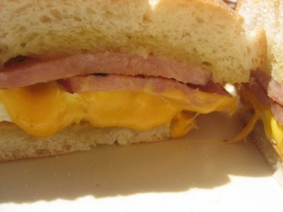 canadian bacon, egg and cheese on a roll