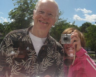 susan and vince in the window reflected.