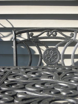 sunlight and shadows on wrought iron