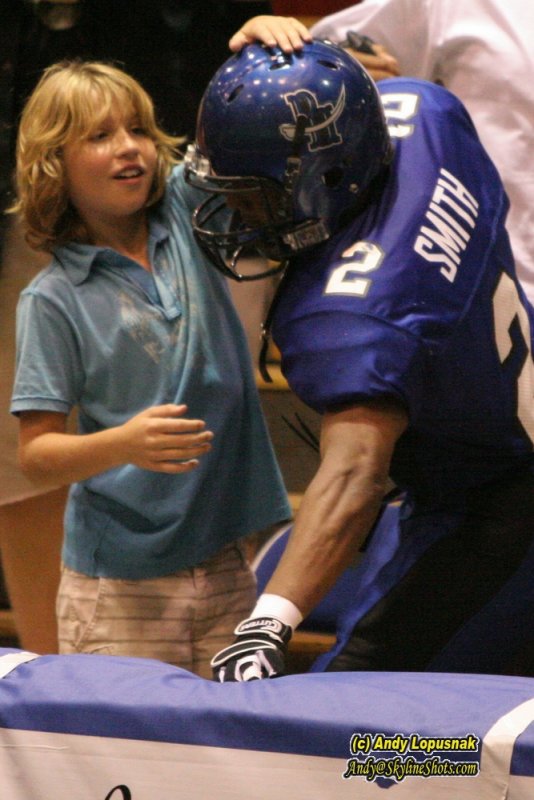 Michigan Pirates DB Ernie Smith and a Pirates fan