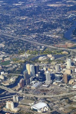 Aerial of downtown Tampa, Florida - Raymond James Stadium & Legends Field faint on the top middle of image