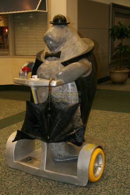 Manatee in a tux on a Segway