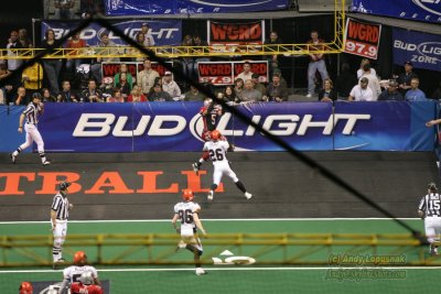 View of Grand Rapids Rampage WR Timon Marshall scoring a TD from behind the nets