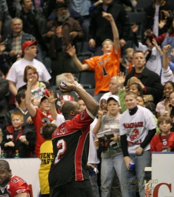Grand Rapids Rampage lineman Gillis Wilson tossing footballs to the crowd