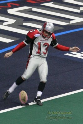 Grand Rapids Rampage kicker Brian Gowins kicking the commerative Mothers Day football