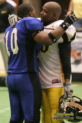 Shawn Hackett & Eric Gardner hug after the game
