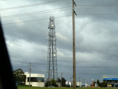 Communication tower, through car window.