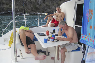 Scotty, Jamaica and One Eye (prone) relaxing Chatham Bay, Union Island