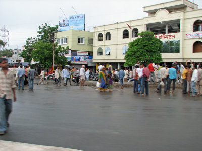Crowd in front of hospital after a rain shower