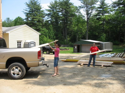 Gina and Lisa unloading 2x4s