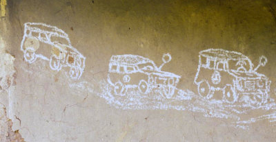 Kenya -- kids chalk drawing of big SUV vehicles (government, aid projects) that pass by the village (1986-87)